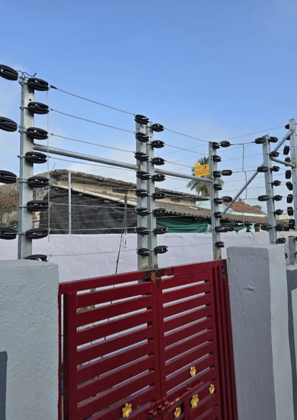 Gate with electric fence wires and insulated posts